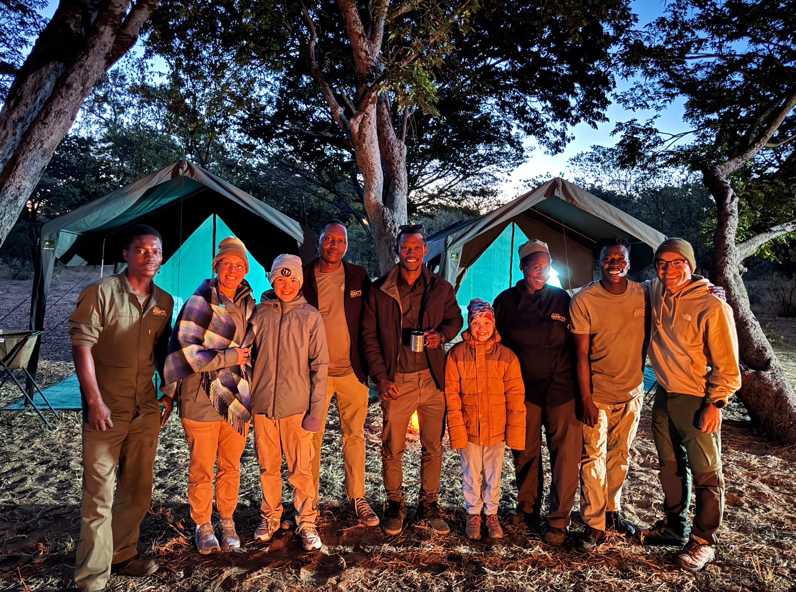 Safari Addicts team and guests together at their mobile camp in Botswana